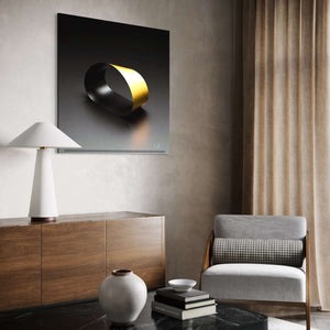 Black Loop
A striking black infinity loop with dramatic contrast on a light background, hanging above a white lamp on a bureau