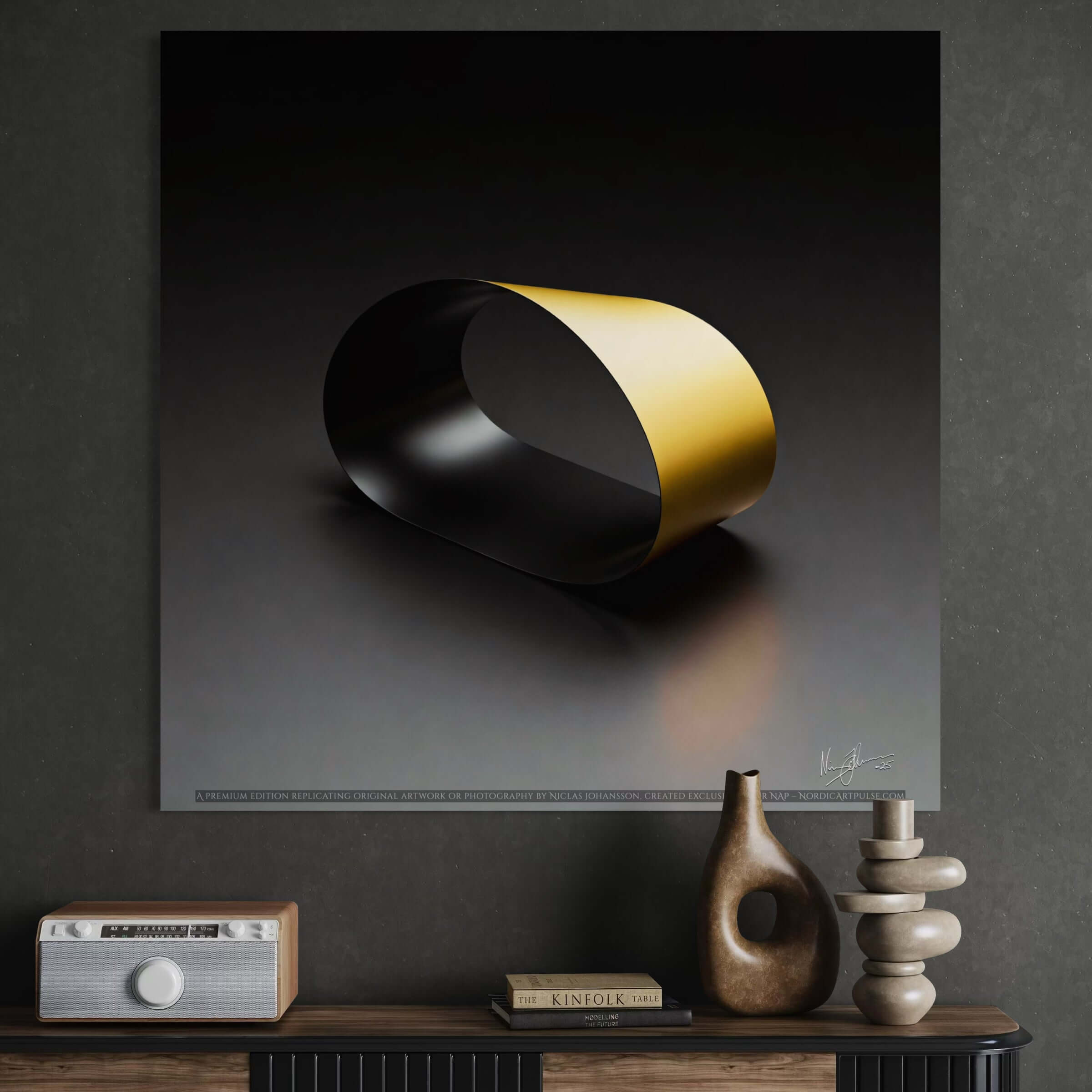 Black Loop
A striking black infinity loop with dramatic contrast on a light background, hanging above a bureau.